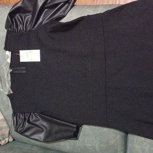 A brand new beautiful  Michael Kors black dress.